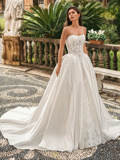 Enzoani Windsor luxury ballgown wedding dress featuring a lace corset bodice, sweetheart neckline, satin skirt and dramatic cathedral train.