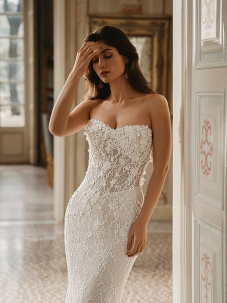 Enzoani Winnie luxury mermaid wedding dress featuring floral lace appliqué, illusion corsetry, sweetheart neckline and a fitted silhouette