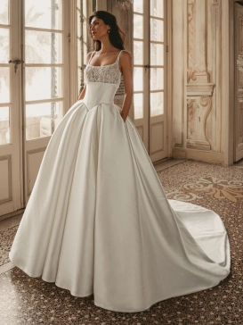 Enzoani Wren is a luxury satin ballgown wedding dress featuring a delicately embroidered lace bodice, elegant square neckline, supportive shoulder straps and a dramatic cathedral-length train. Designed for brides seeking a timeless designer wedding gown th