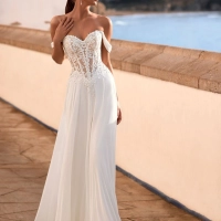 Love Felinna wedding dress by Enzoani featuring an illusion lace corset bodice, detachable off-the-shoulder straps, and a flowing chiffon A-line skirt for romantic elegance.