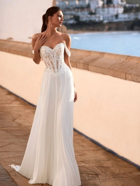 Love Felinna wedding dress by Enzoani featuring an illusion lace corset bodice, detachable off-the-shoulder straps, and a flowing chiffon A-line skirt for romantic elegance.