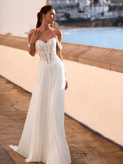 Love Felinna wedding dress by Enzoani featuring an illusion lace corset bodice, detachable off-the-shoulder straps, and a flowing chiffon A-line skirt for romantic elegance.