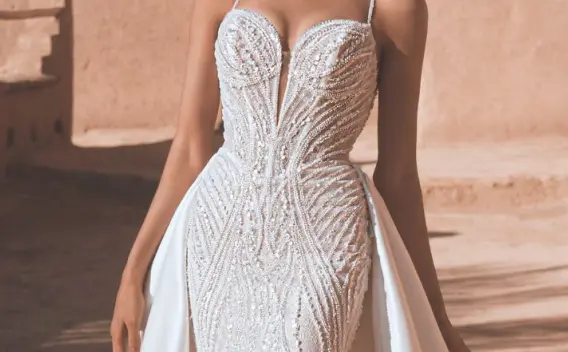 Wedding dress with two distinct looks—beaded 2026 Enzoani gown with a removable overskirt for ceremony-to-reception transformation