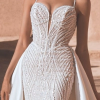 Wedding dress with two distinct looks—beaded 2026 Enzoani gown with a removable overskirt for ceremony-to-reception transformation